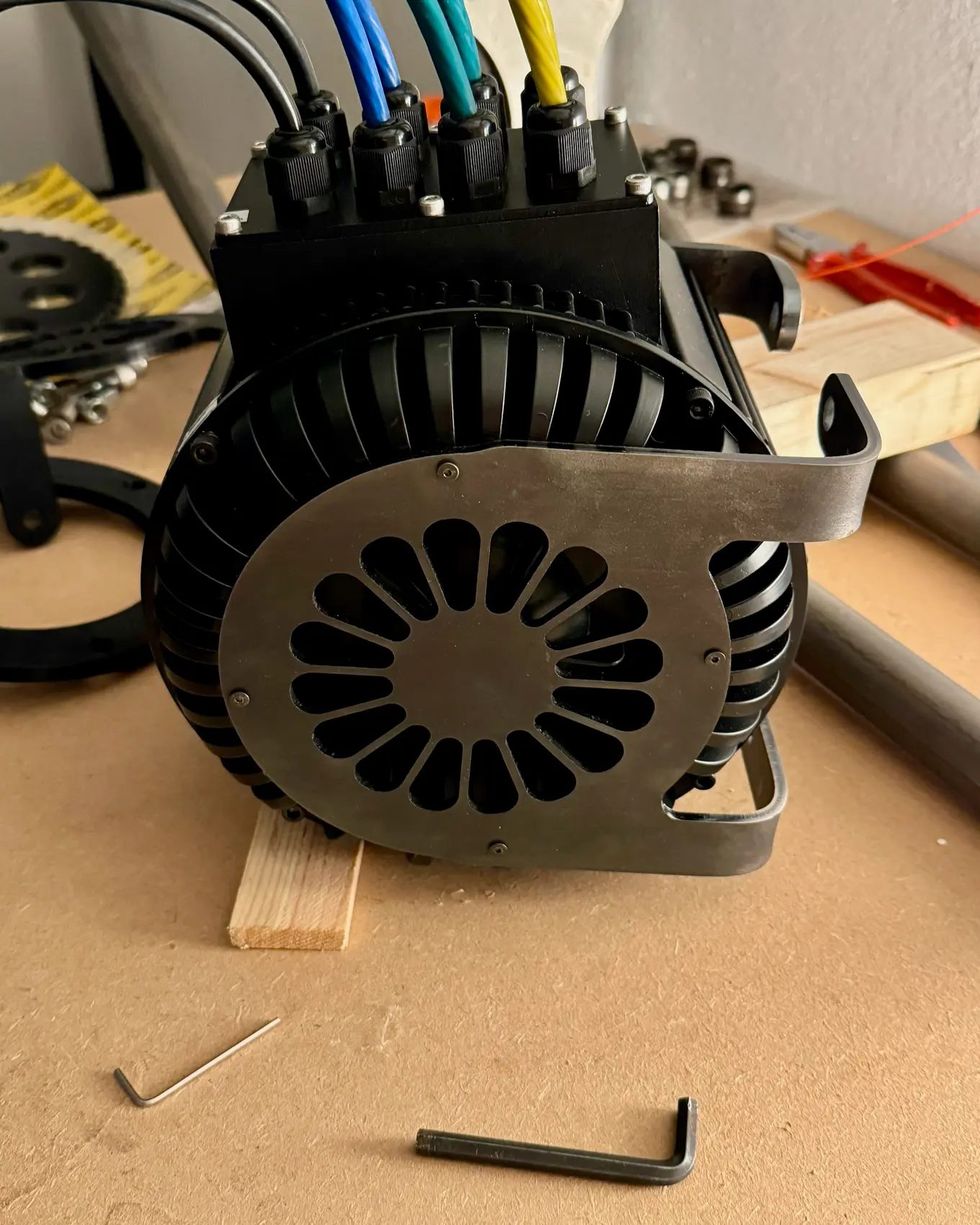 The motor with its cover fitted, mounted in the frame