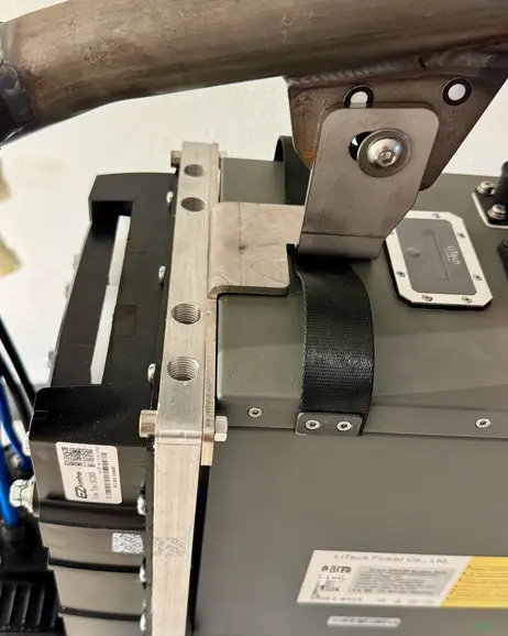 A close view of the battery box and its mounting bracket
