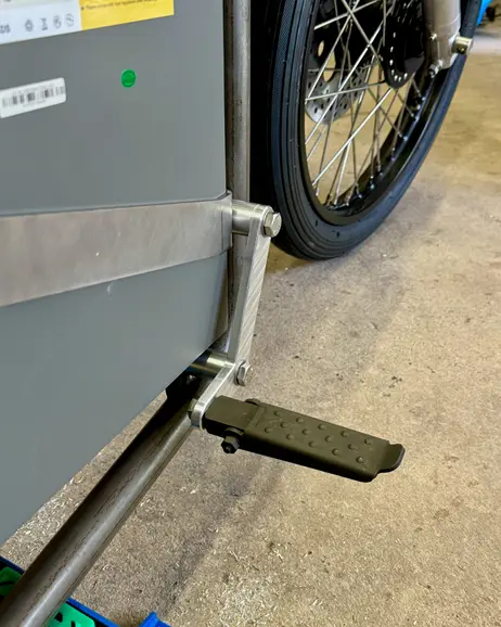 The floorboard folded down against the garage floor