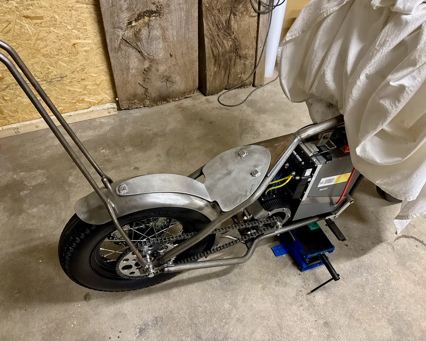 The bike pushed into the corner of the garage