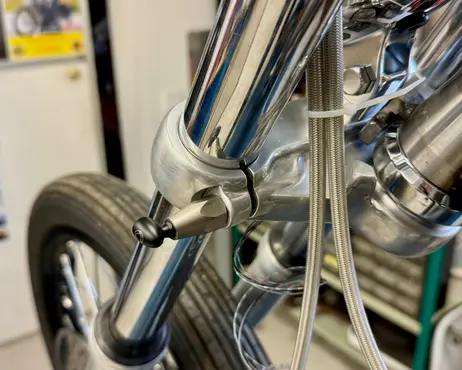 The front wheel and fork leg, seen from the side