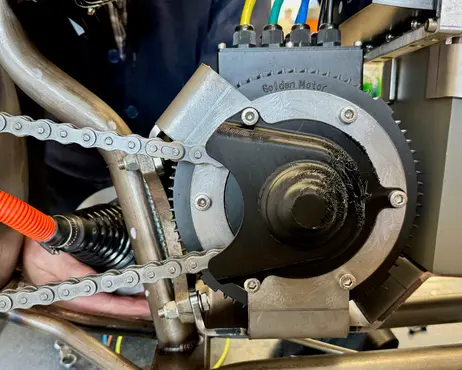 The chain and motor with a printed front sprocket guard fitted