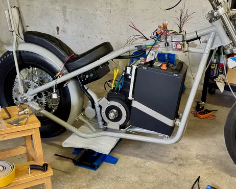 The painted bike part-assembled, battery box back in the frame