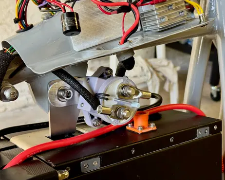 The terminals under the tank that the mounting has to clear